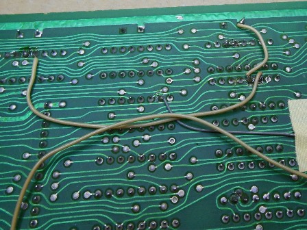 Cut track between pins to restore and join to remove